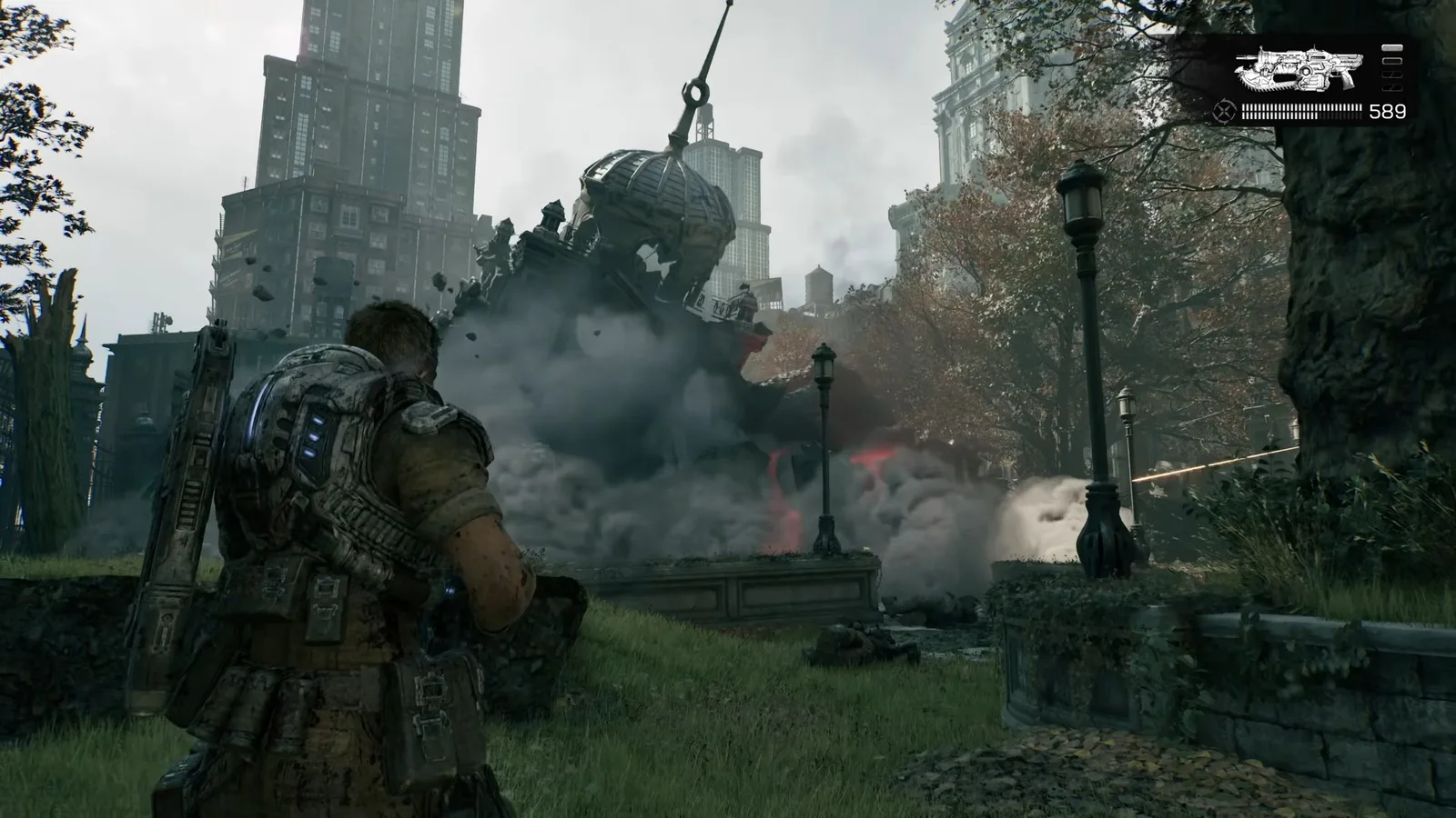 A COG soldier stands near a low stone wall as a large building collapses in the distance.