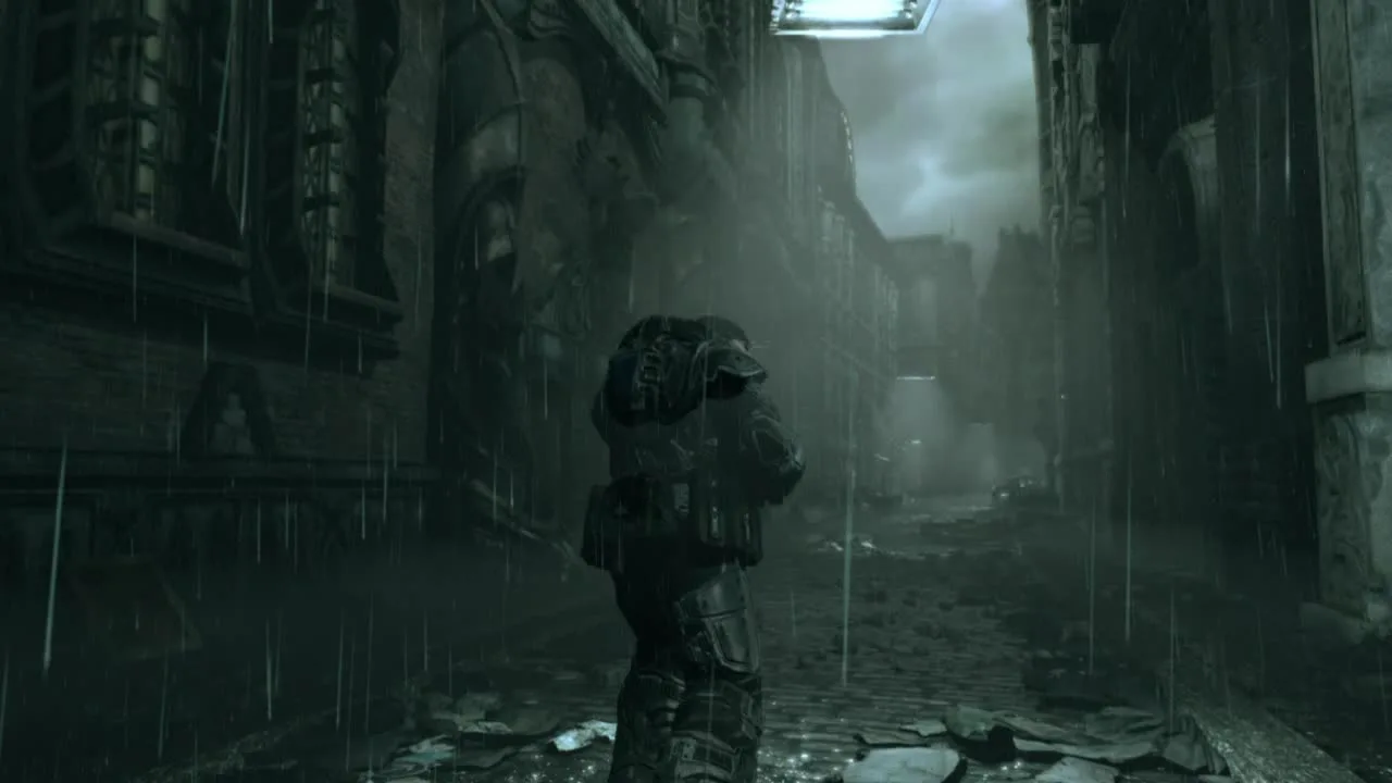 Marcus Fenix walking alone through a rain-soaked ruined city street