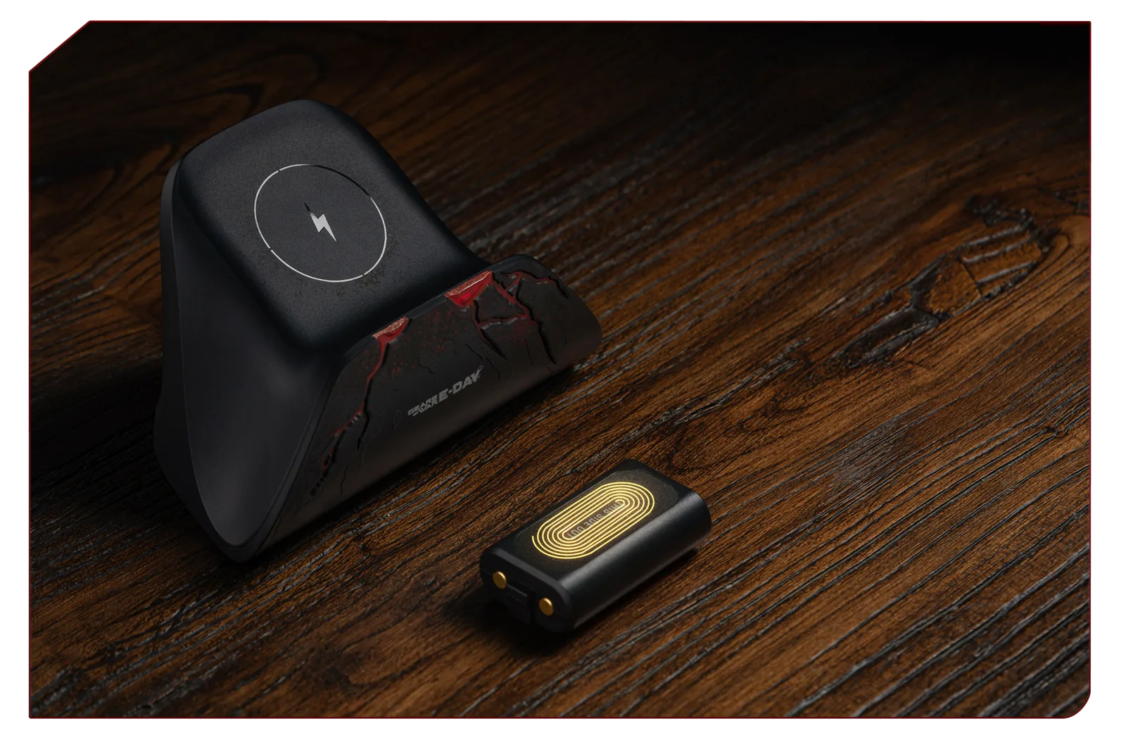 Gears of War: E-Day charging dock beside the included 1000mAh battery pack